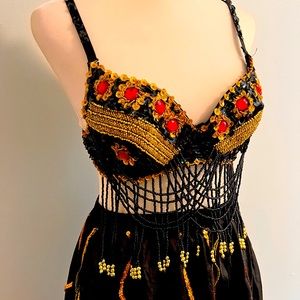 Beaded top and black flowy skirt with sequins.